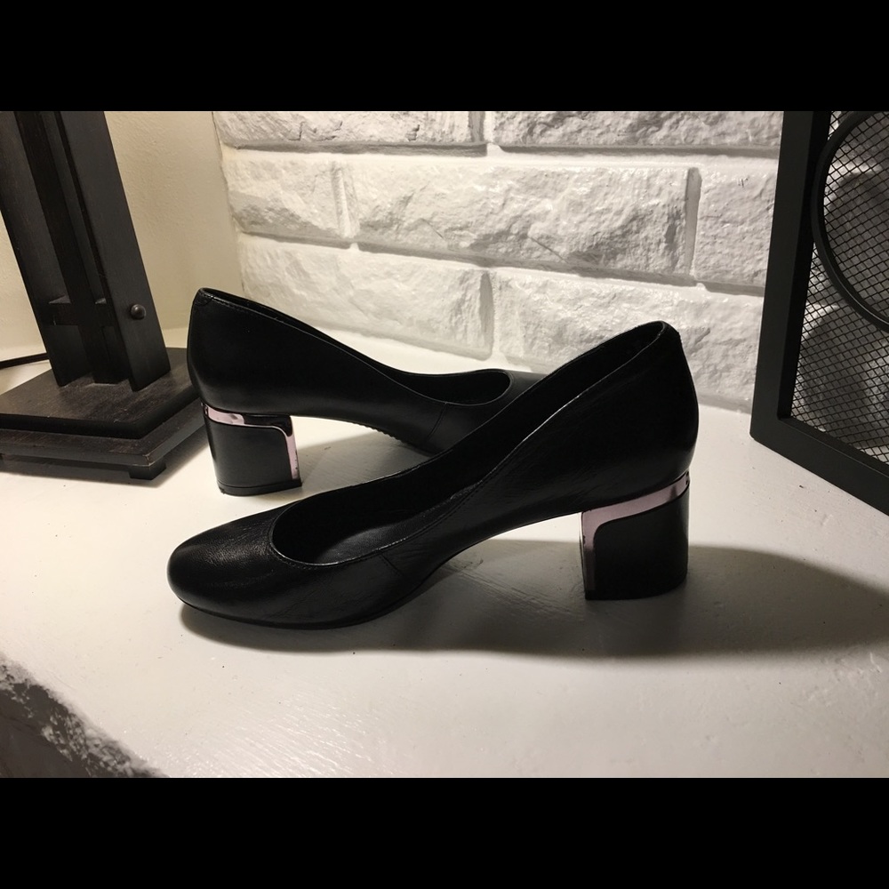Black pumps with silver accents. Gently worn.